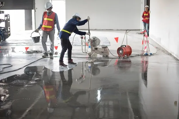 Commercial cleaning team preparing refurbished office for handover